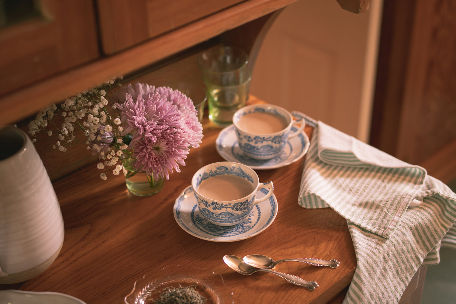 A cup of hot tea served elegantly in English tea cups, the perfect rainy spring day pick-me-up. London Fog Cocoa